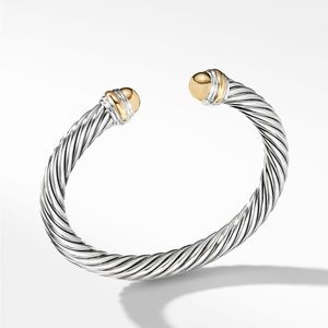 Worn David Yurman cable classics bracelet with 14k yellow gold domes